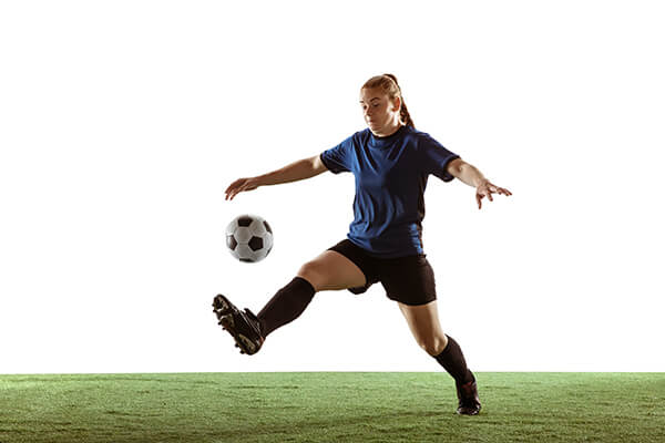 A player kicking the ball