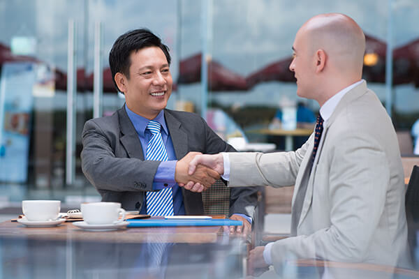 Businessmen introducing each other