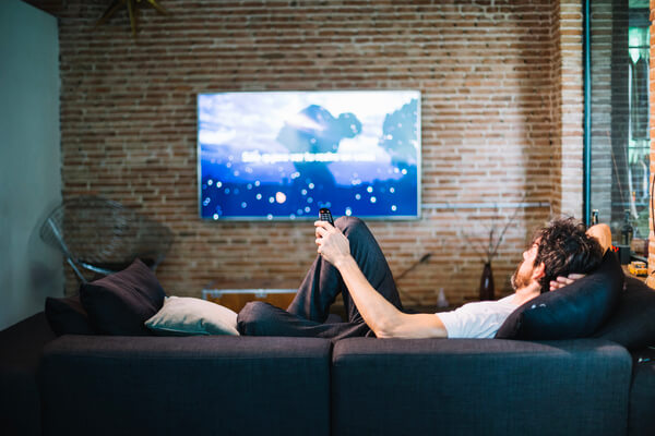 A man watching TV