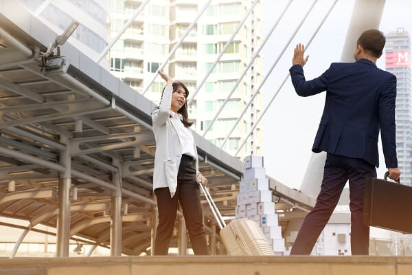 Woman waving goodbye
